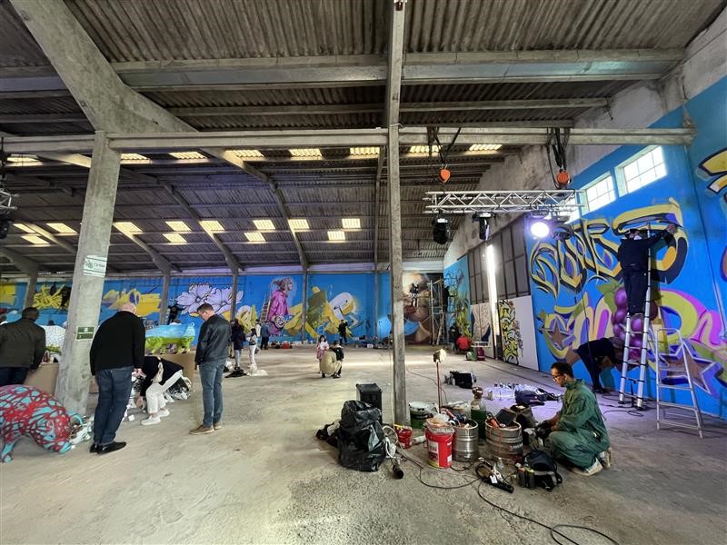 Corporate social responsibility in property management supporting art foundation in Portugal through community mural project.